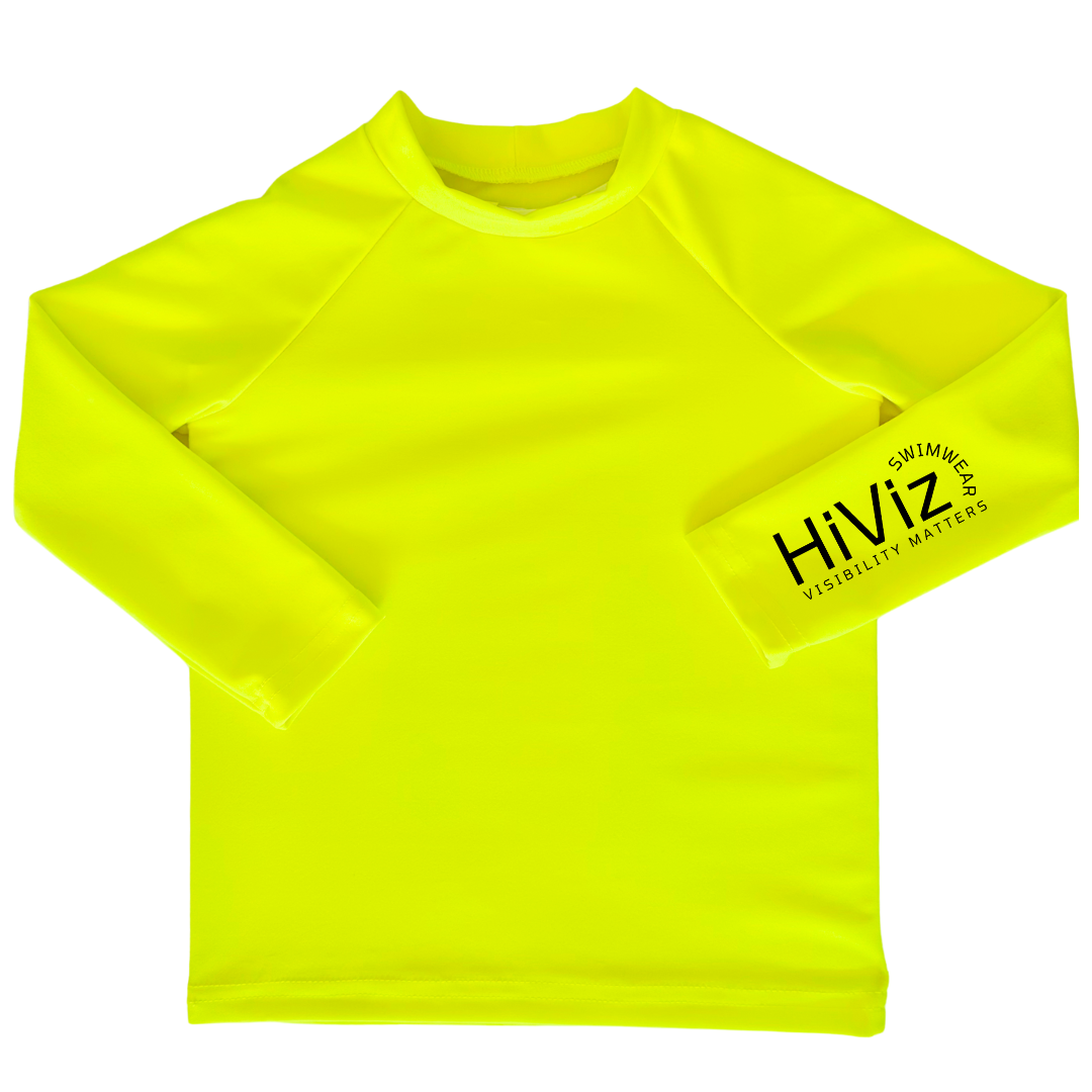 Bright swimwear for toddlers, this is a product image of a toddler neon yellow rash guard with HiViz bright swimwear logo on the left sleeve.